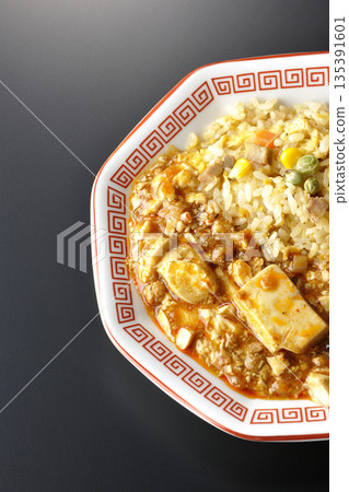 Mapo tofu fried rice photographed against a black background Mapo tofu fried rice photographed against a black background 135391601