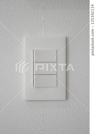 Close-up of a white wall and switch 135392114
