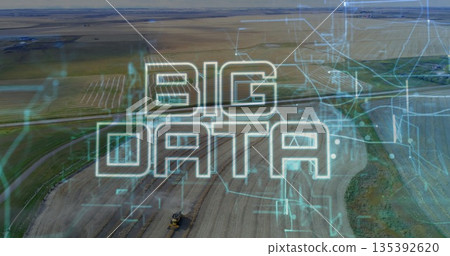 Displaying stylized BIG DATA text overlaying farmland, with tractor and circuit patterns Displaying stylized BIG DATA text overlaying farmland, with tractor and circuit patterns 135392620