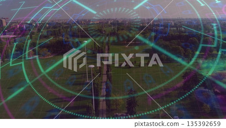 Overlaying HUD graphics across aerial park promenade, with lamp posts, trees and skyline 135392659