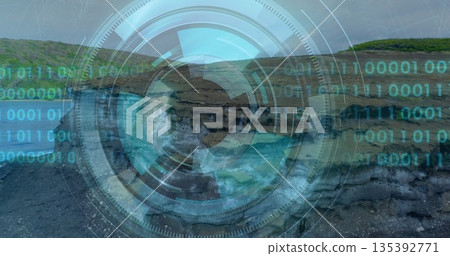 Displaying circular digital interface overlay floating above rocky inlet, with binary code streams 135392771