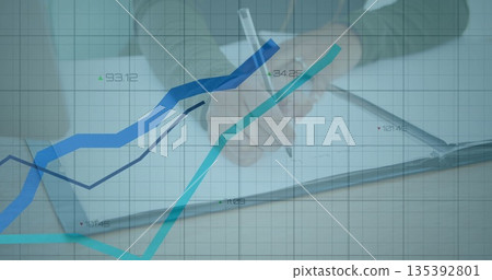 Writing office worker tracking financial data in notebook at desk, with pen and line graph overlay Writing office worker tracking financial data in notebook at desk, with pen and line graph overlay 135392801