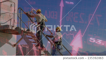 Climbing two workers with safety harnesses on industrial staircase, financial overlay, copy space 135392863