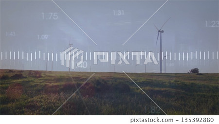Displaying prominent wind turbine spinning on grass plain, with scale graphic overlay, copy space 135392880