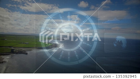 Circular interface showing rings, arrow indicators hovering over coastal farmland, with data panels 135392945