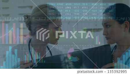 Reviewing 2 female doctors holding radiograph film in clinic with stethoscopes, data visualizations Reviewing 2 female doctors holding radiograph film in clinic with stethoscopes, data visualizations 135392995