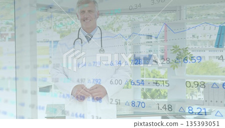 Standing male doctor wearing white lab coat smiling in office, with stethoscope and data overlays Standing male doctor wearing white lab coat smiling in office, with stethoscope and data overlays 135393051