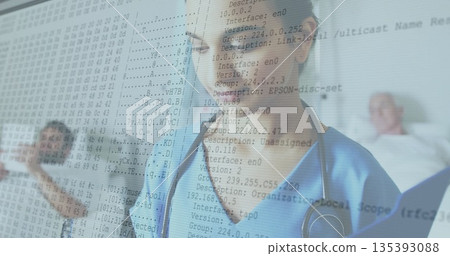 Indian female nurse in blue scrubs holding stethoscope between hospital beds, with network overlay Indian female nurse in blue scrubs holding stethoscope between hospital beds, with network overlay 135393088