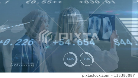 Reviewing team in lab coat and scrubs analyzing X-ray on lightbox in radiology with data overlays 135393097