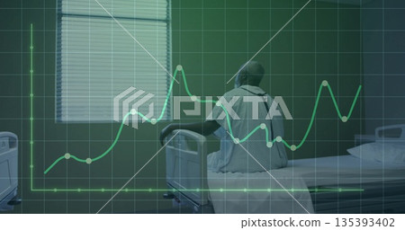 Sitting elderly patient wearing white gown on bed rail in hospital room, with green chart overlay 135393402