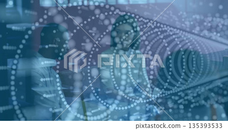 Discussing strategy two seated colleagues talking on sofa in office lounge, with data visualization 135393533