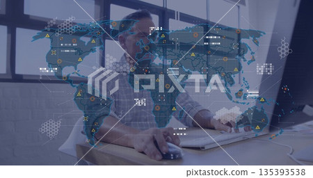 Analyzing digital map overlay, IT analyst interacting with monitor and mouse at desk in office Analyzing digital map overlay, IT analyst interacting with monitor and mouse at desk in office 135393538