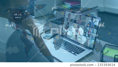 Joining mature Asian woman connecting with team at desk, with laptop smartphone and map overlay 135393614