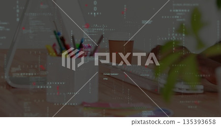 Developer hands typing code on keyboard at desk, featuring white pencil mug with colored pencils Developer hands typing code on keyboard at desk, featuring white pencil mug with colored pencils 135393658