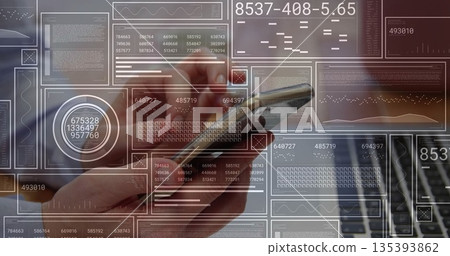 Holding hand of analyst tracking digital charts on smartphone at office desk, with laptop keyboard 135393862