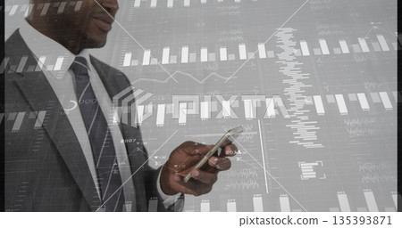 Scanning businessman in suit checking smartphone data on gray wall, with chart overlays, copy space 135393871