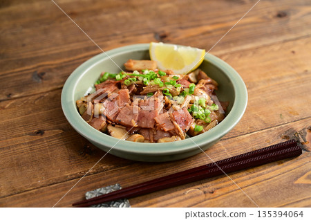 Stir-fried mushrooms and bacon with butter and soy sauce 135394064