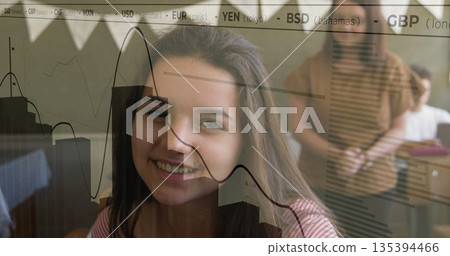 Smiling teenage girl wearing red shirt engaging in classroom lesson, with financial chart overlay Smiling teenage girl wearing red shirt engaging in classroom lesson, with financial chart overlay 135394466