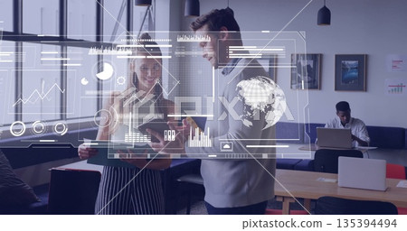 Discussing project two coworkers examining tablet with stylus in modern office, with data overlays Discussing project two coworkers examining tablet with stylus in modern office, with data overlays 135394494