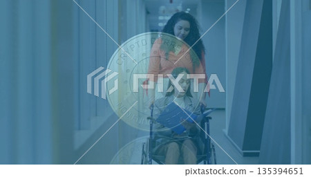 Caregiver pushing patient in wheelchair through hospital corridor, patient holding blue folder Caregiver pushing patient in wheelchair through hospital corridor, patient holding blue folder 135394651