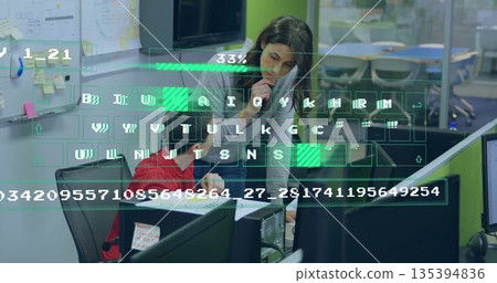 Collaborating coworkers writing printed document at office desk with phone and digital overlay 135394836