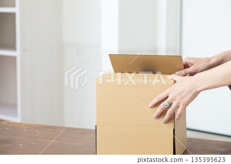 Assembling a cardboard box 135395623