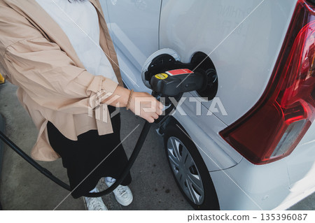 fueling, gas station, female 135396087
