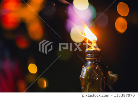 bottle with candle inside of it bottle with candle inside of it 135397070