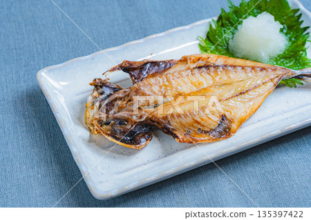 Filleted horse mackerel served on a white square plate with grated daikon radish and shiso leaves Filleted horse mackerel served on a white square plate with grated daikon radish and shiso leaves 135397422