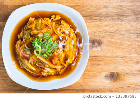 Tianjin rice topped with a thick sauce Tianjin rice topped with a thick sauce 135397585