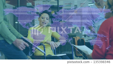 Leading woman in wheelchair guiding office team using digital map, tablet and documents Leading woman in wheelchair guiding office team using digital map, tablet and documents 135398346