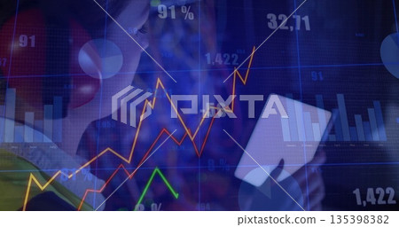 Analyzing woman wearing red headphones viewing white tablet in workspace, market charts, copy space Analyzing woman wearing red headphones viewing white tablet in workspace, market charts, copy space 135398382