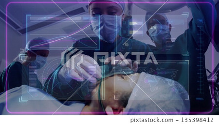 Lead surgeon performing head scan in operating room in gown, with handheld scanner and AR overlays Lead surgeon performing head scan in operating room in gown, with handheld scanner and AR overlays 135398412