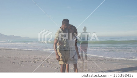 Walking romantic couple holding hands near water's edge at sandy beach, calm ocean horizon Walking romantic couple holding hands near water's edge at sandy beach, calm ocean horizon 135398432
