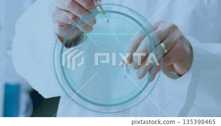 Holding two metal keys, senior scientist in lab coat presenting digital lock overlay in lab 135398465