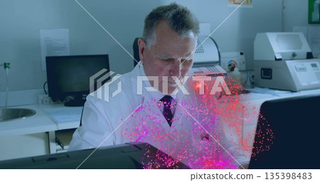Scientist in lab coat analyzing particle visualization overlay on screen in lab, with centrifuge Scientist in lab coat analyzing particle visualization overlay on screen in lab, with centrifuge 135398483