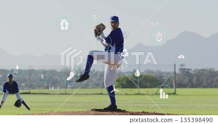 Baseball player in blue uniform pitching on mound at baseball diamond, with glove and overlay icons 135398490