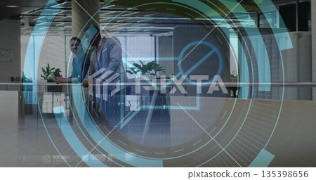 Leaning colleagues discussing ideas on atrium railing with plants, digital overlay, copy space Leaning colleagues discussing ideas on atrium railing with plants, digital overlay, copy space 135398656