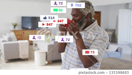 Sipping African American man holding red mug at stone island, with floating social media icons 135398683