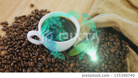 Sitting white mug of black coffee on cafe tabletop with burlap sack, beans, green hologram globe 135398740