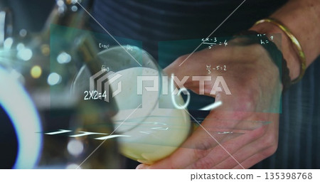 Capturing bartender hands pouring beer with foam under draft tap at bar, with holographic formulas Capturing bartender hands pouring beer with foam under draft tap at bar, with holographic formulas 135398768