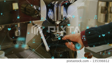 Locking sweater-clad hand inserting portafilter into espresso maker at cafe counter with IoT icons Locking sweater-clad hand inserting portafilter into espresso maker at cafe counter with IoT icons 135398812