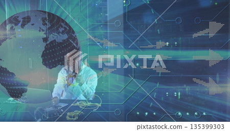 Holding yellow cables man in checkered shirt connecting circuit board at desk, with laptop graphics Holding yellow cables man in checkered shirt connecting circuit board at desk, with laptop graphics 135399303