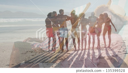 Group of friends linking arms in colorful swimwear on sandy shore, with translucent ring overlay Group of friends linking arms in colorful swimwear on sandy shore, with translucent ring overlay 135399328