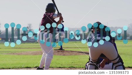Swinging female batter gripping wooden bat on baseball diamond, with catcher mitt, copy space 135399373