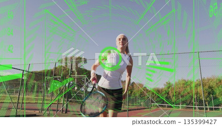 Swinging racket tennis player hitting incoming ball on hardcourt, through green HUD at tennis net 135399427