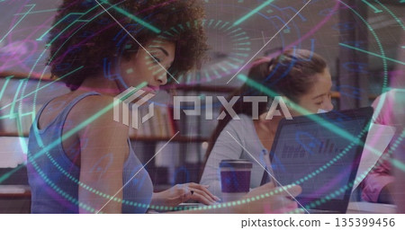 Typing woman in sleeveless top at library on laptop, with coffee cup, digital overlay, copy space Typing woman in sleeveless top at library on laptop, with coffee cup, digital overlay, copy space 135399456