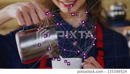 Barista wearing red apron pouring milk at cafe counter, with pitcher, mug and purple icon overlay Barista wearing red apron pouring milk at cafe counter, with pitcher, mug and purple icon overlay 135399524