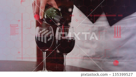 Server wearing white apron pouring red wine into two glasses at bar table, with green bottle Server wearing white apron pouring red wine into two glasses at bar table, with green bottle 135399527