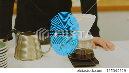Brewing coffee by barista wearing sweater at white counter, with kettle, dripper on carafe on scale 135399529